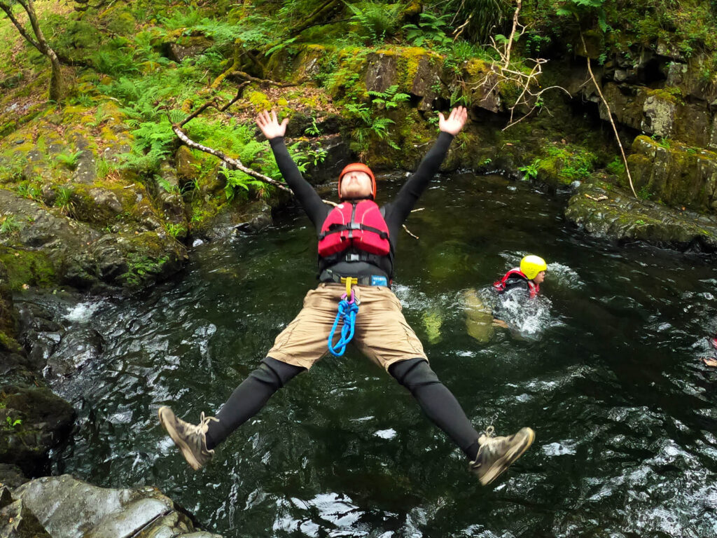 Jumping in at the start of our Canyoning trip; there's no staying dry here!